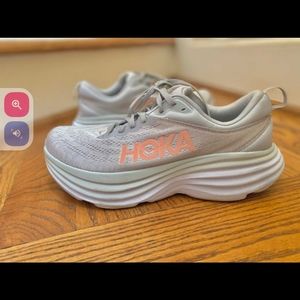 HOKA Footwear Sz. 10. Gray color,  orange HOKA brand label. Wide. Running shoes